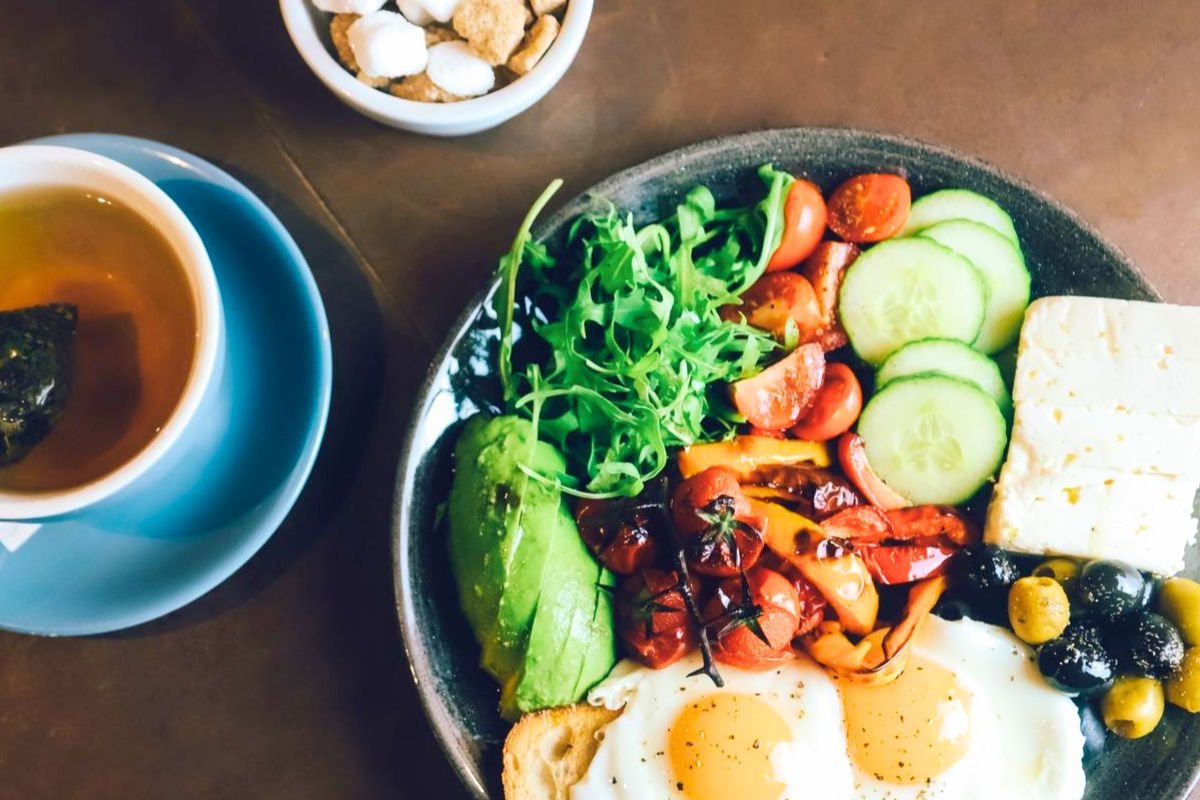 Healthy Mediterranean breakfast with eggs, vegetables and bread